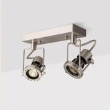 Dual spotlight fixture in a brushed steel finish shown from a side perspective.