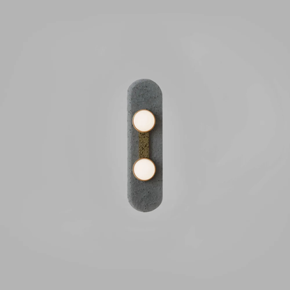 Two bulb sconce with brass mount on dark raindrop textured backplate