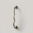 Single wavy stainless steel handle mounted on a plain light surface