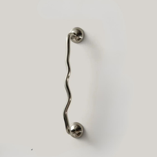 Single wavy stainless steel handle mounted on a plain light surface