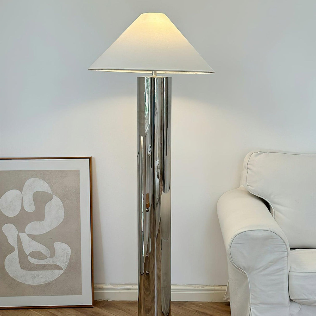 close-up of chrome lamp base showing round reflective metal platform
