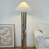 close-up of chrome lamp base showing round reflective metal platform