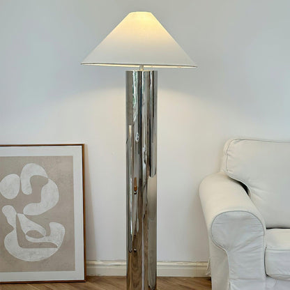 close-up of chrome lamp base showing round reflective metal platform