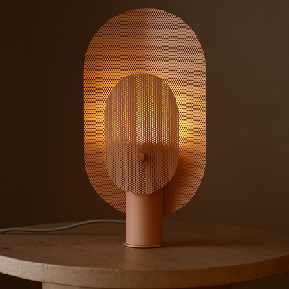 Modern table lamp with perforated design on a dark background