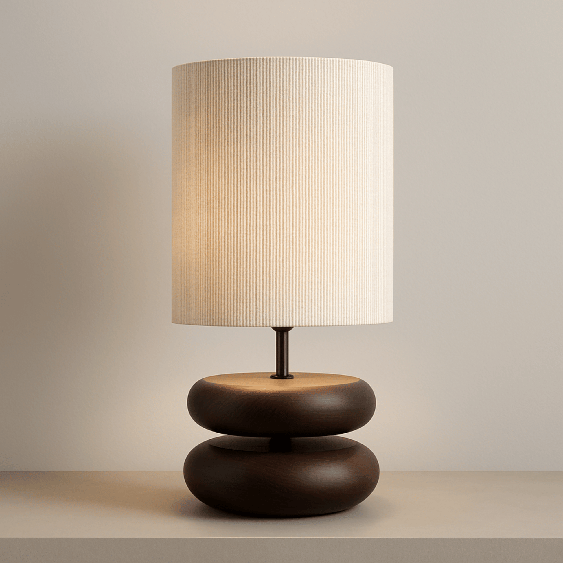 Wood base and fabric shade table lamp on a gray table