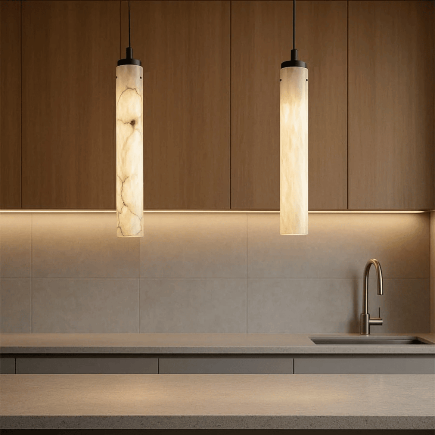 Modern kitchen with pendant lights and a sink.