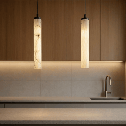 Modern kitchen with pendant lights and a sink.