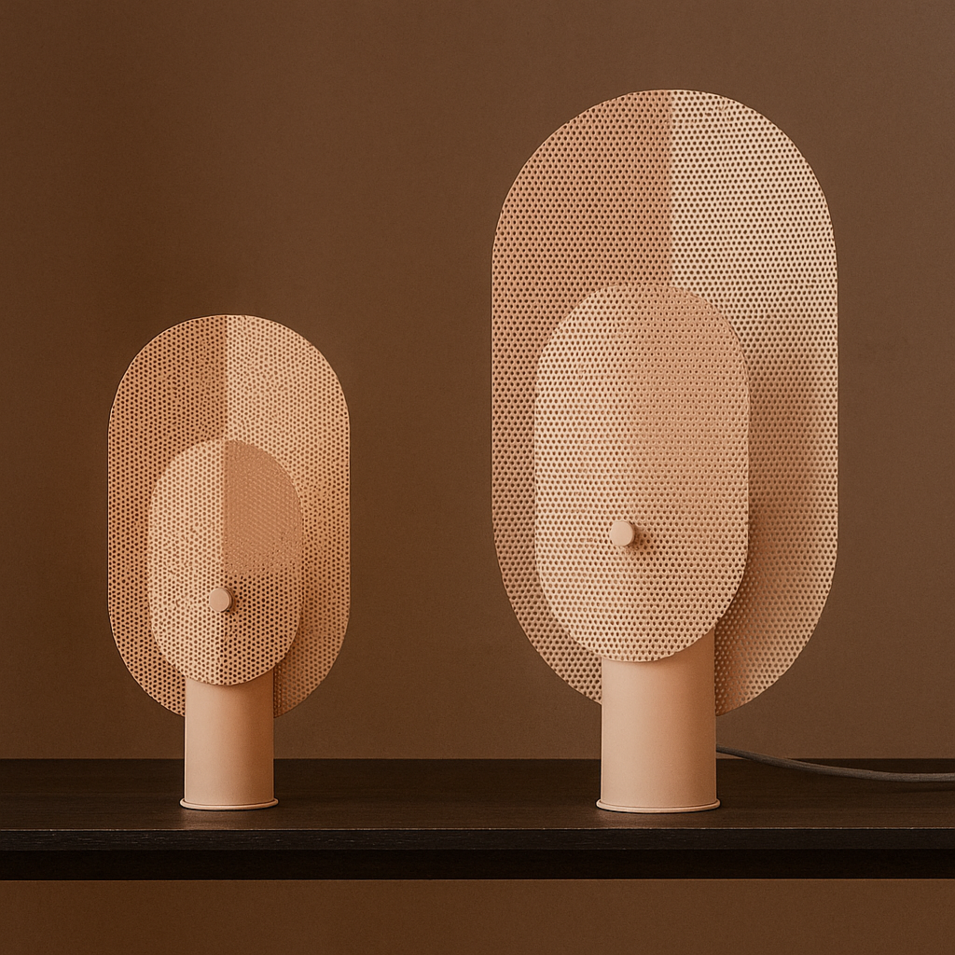 Two decorative wall lights with mesh design on a brown background