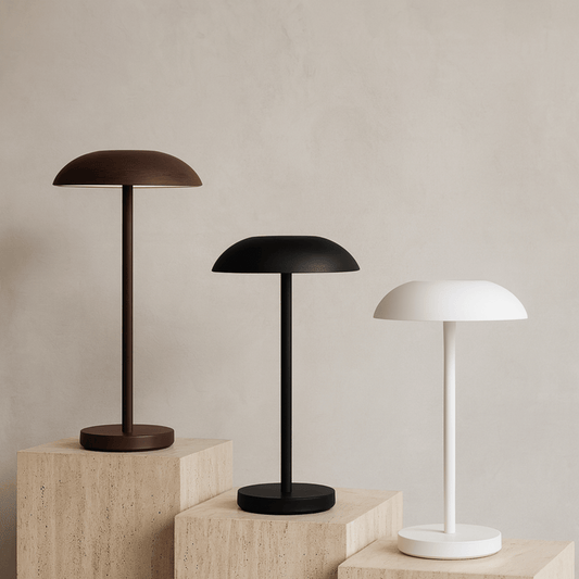 Three table lamps in different colors on a neutral background