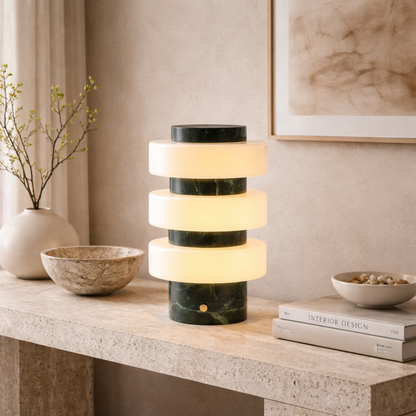 Modern table lamp with marble design on a wooden surface in a home setting