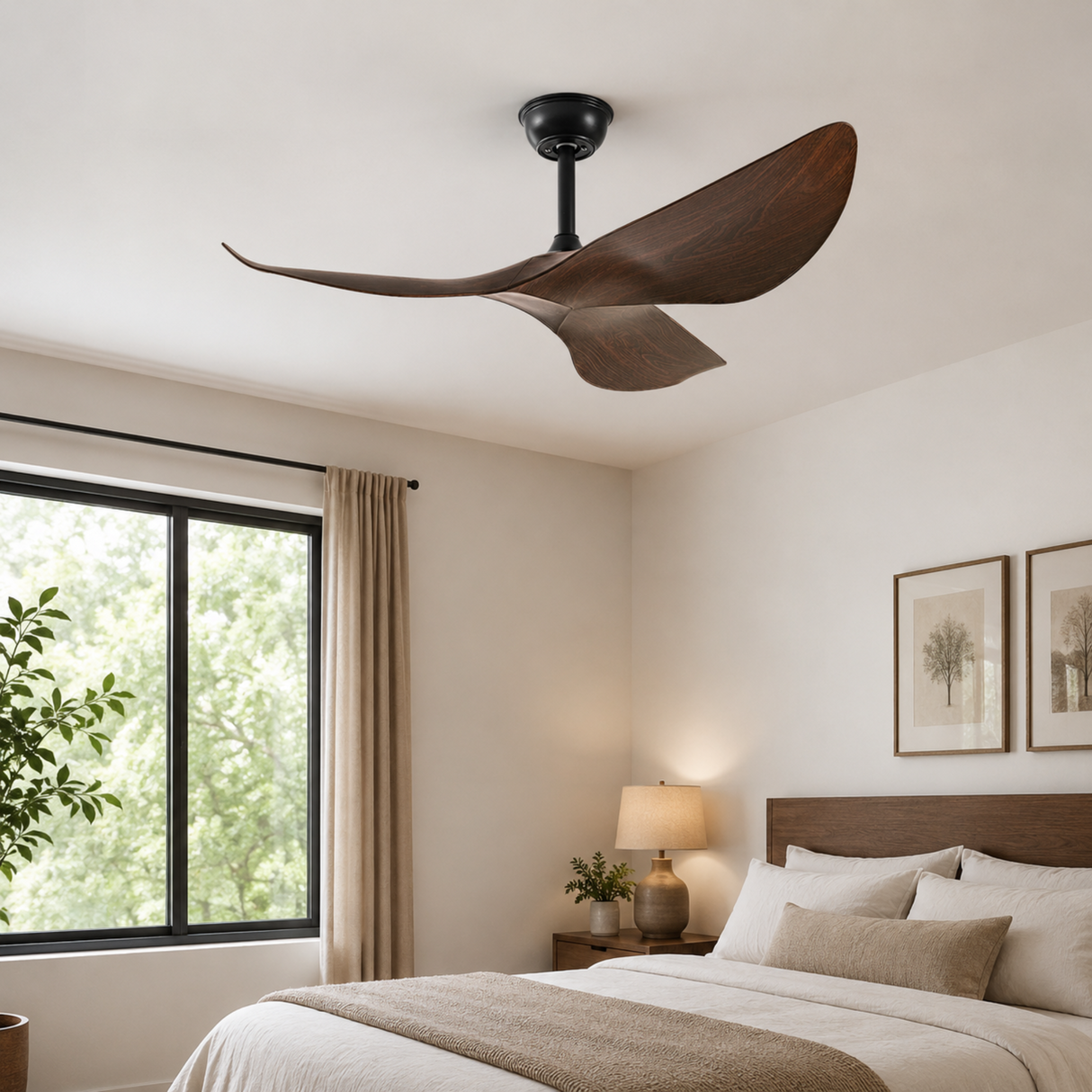 Ceiling fan in a bedroom with a bed, lamp, and window.