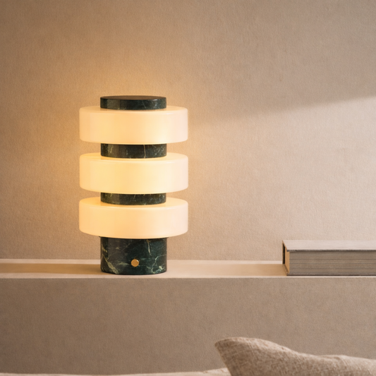 Marble-patterned table lamp on a shelf with a neutral background