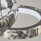 Close-up of a ceiling light fixture with marble-patterned base