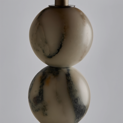 Marble-textured lamp with two spherical shapes on a gray background