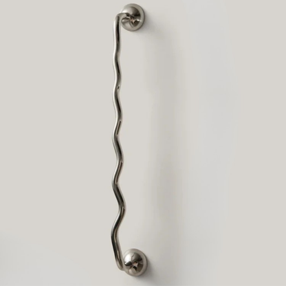 Long wavy metal handle shown against a clean light background