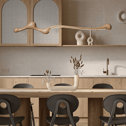 Modern kitchen with wooden cabinets, a dining table, and chairs.