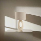 Modern Toki Glow Table Lamp combines artistic design with functionality, making it a perfect addition to your bedroom or living room. Beige & White