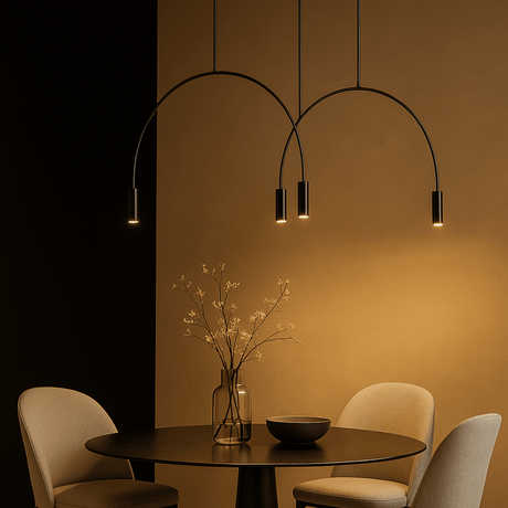 Modern dining room with a black chandelier, round table, and chairs.