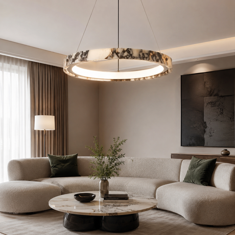 Modern living room with a pendant light, sofa, and coffee table.