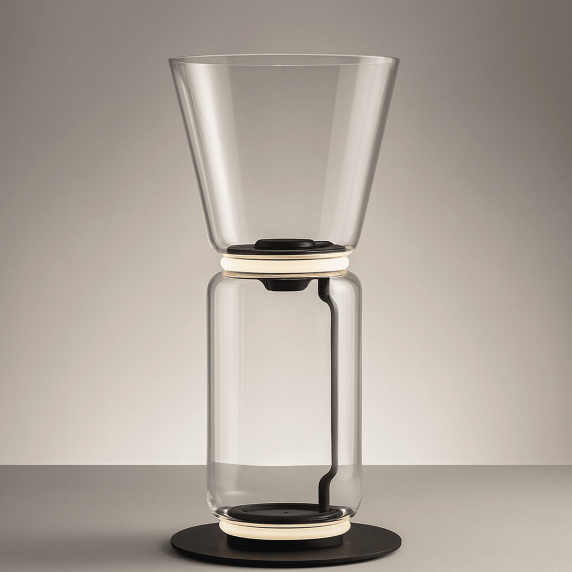 Clear glass coffee maker on a gray background