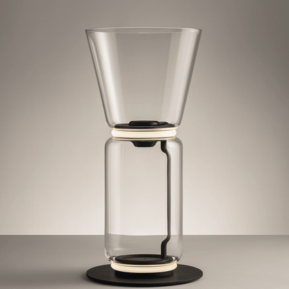 Clear glass coffee maker on a gray background