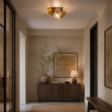 Modern interior hallway with a wooden console table, lamp, and decorative elements.