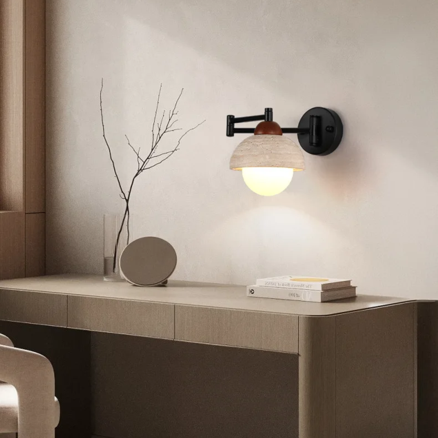 Wall-mounted lamp on a desk with minimal decor in a modern room.