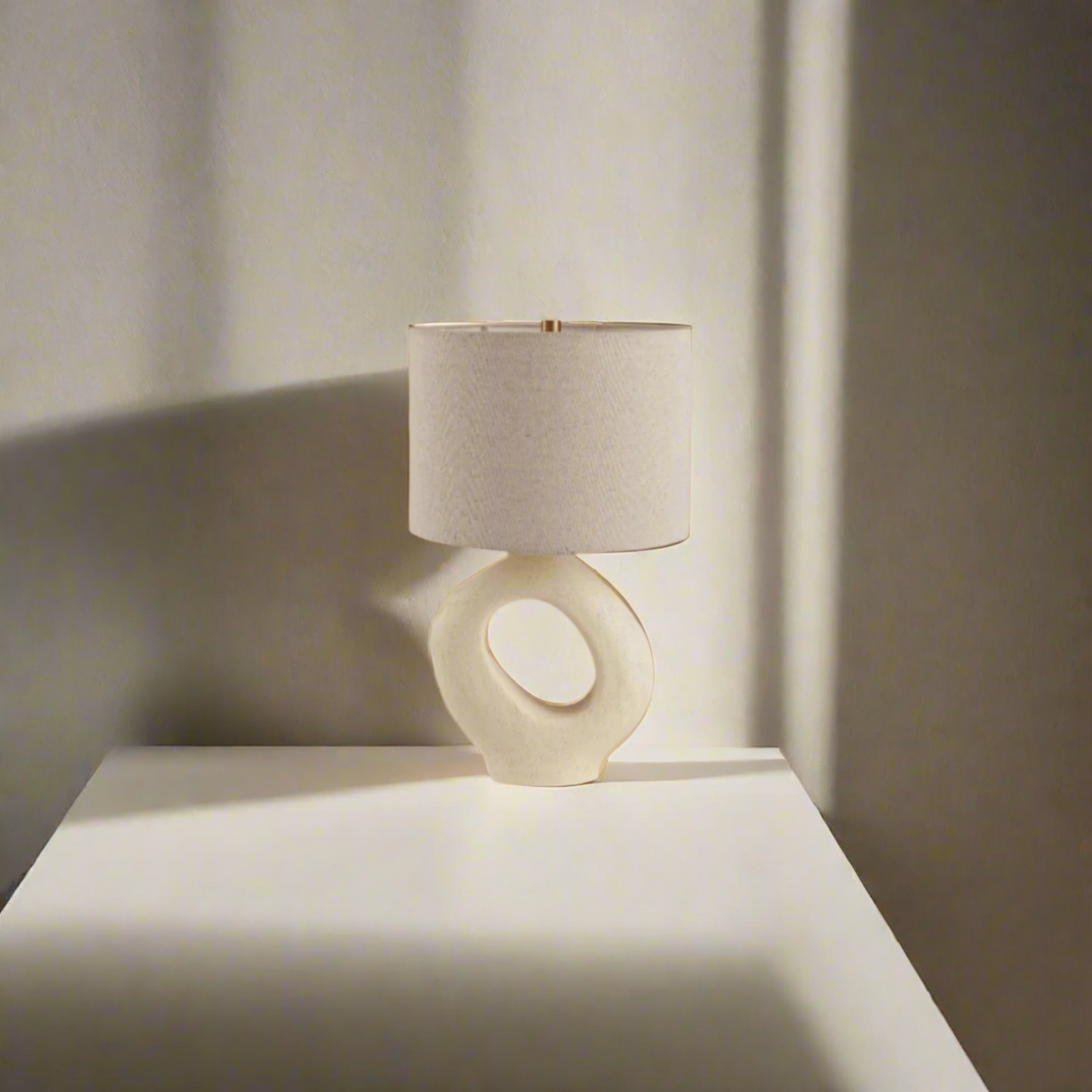 Modern Toki Glow Table Lamp combines artistic design with functionality, making it a perfect addition to your bedroom or living room. Beige 