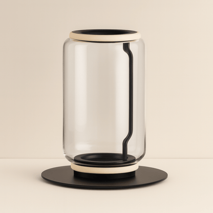 Modern glass table lamp with black base and accents on a beige background