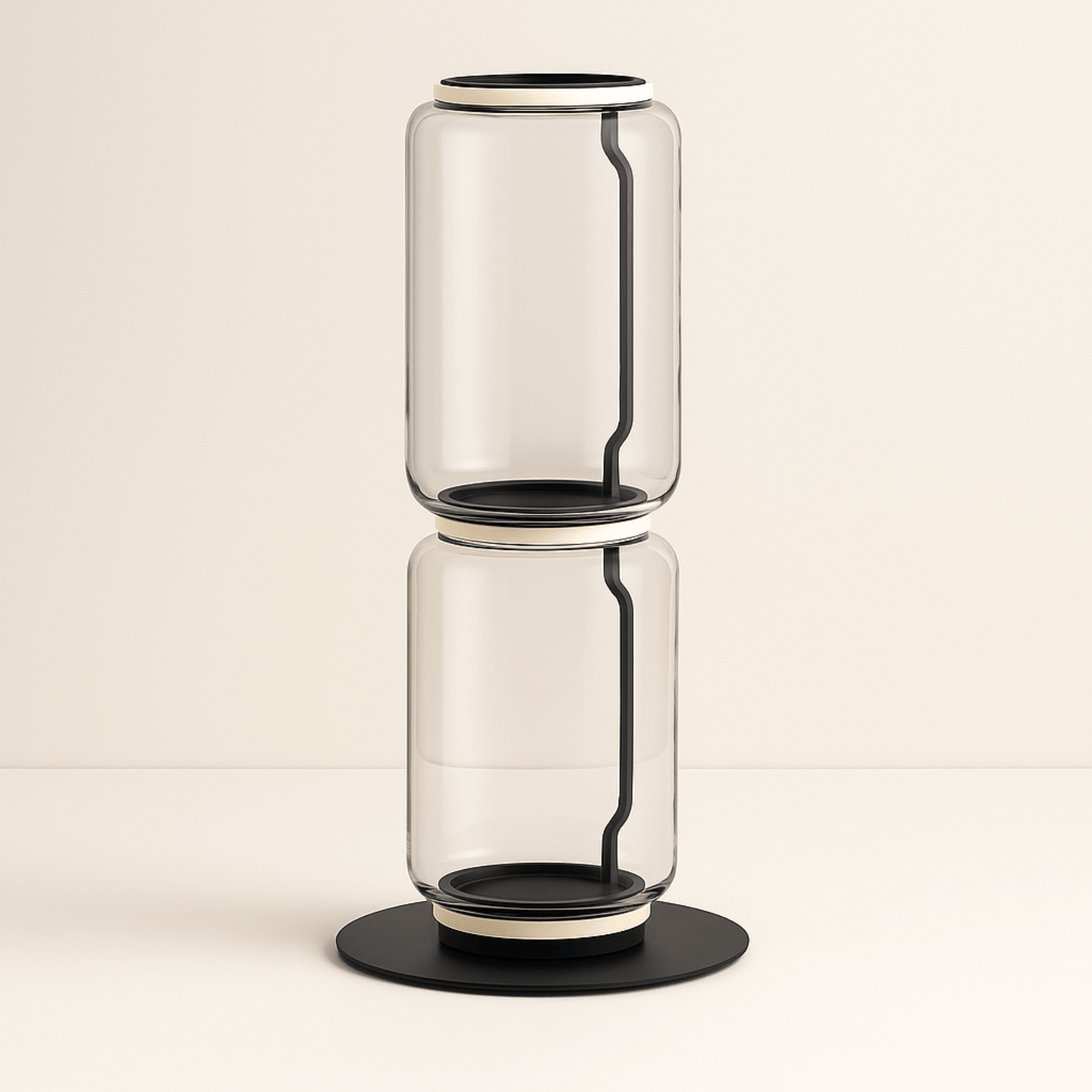 Clear glass vase with black accents on a beige background