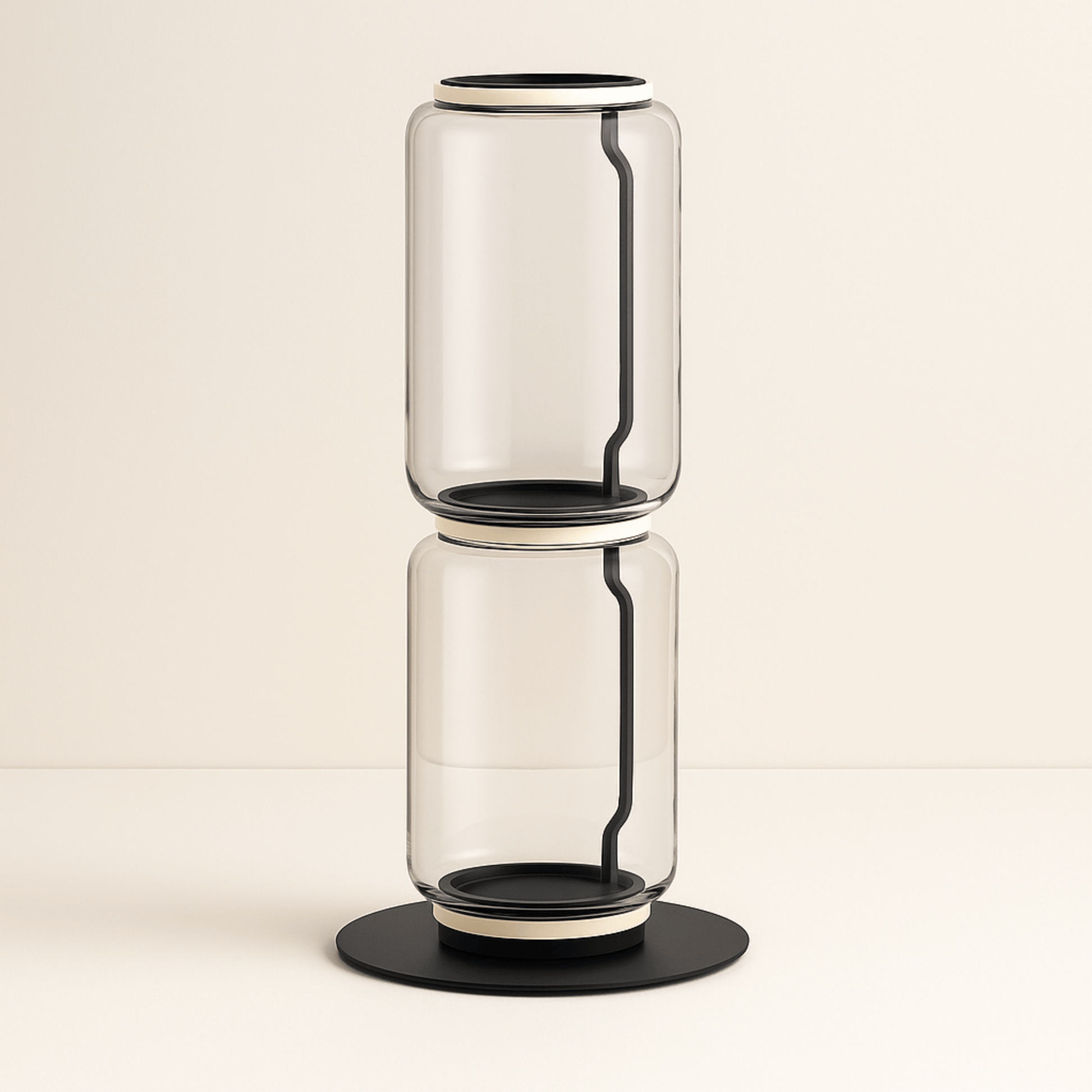 Clear glass vase with black accents on a beige background