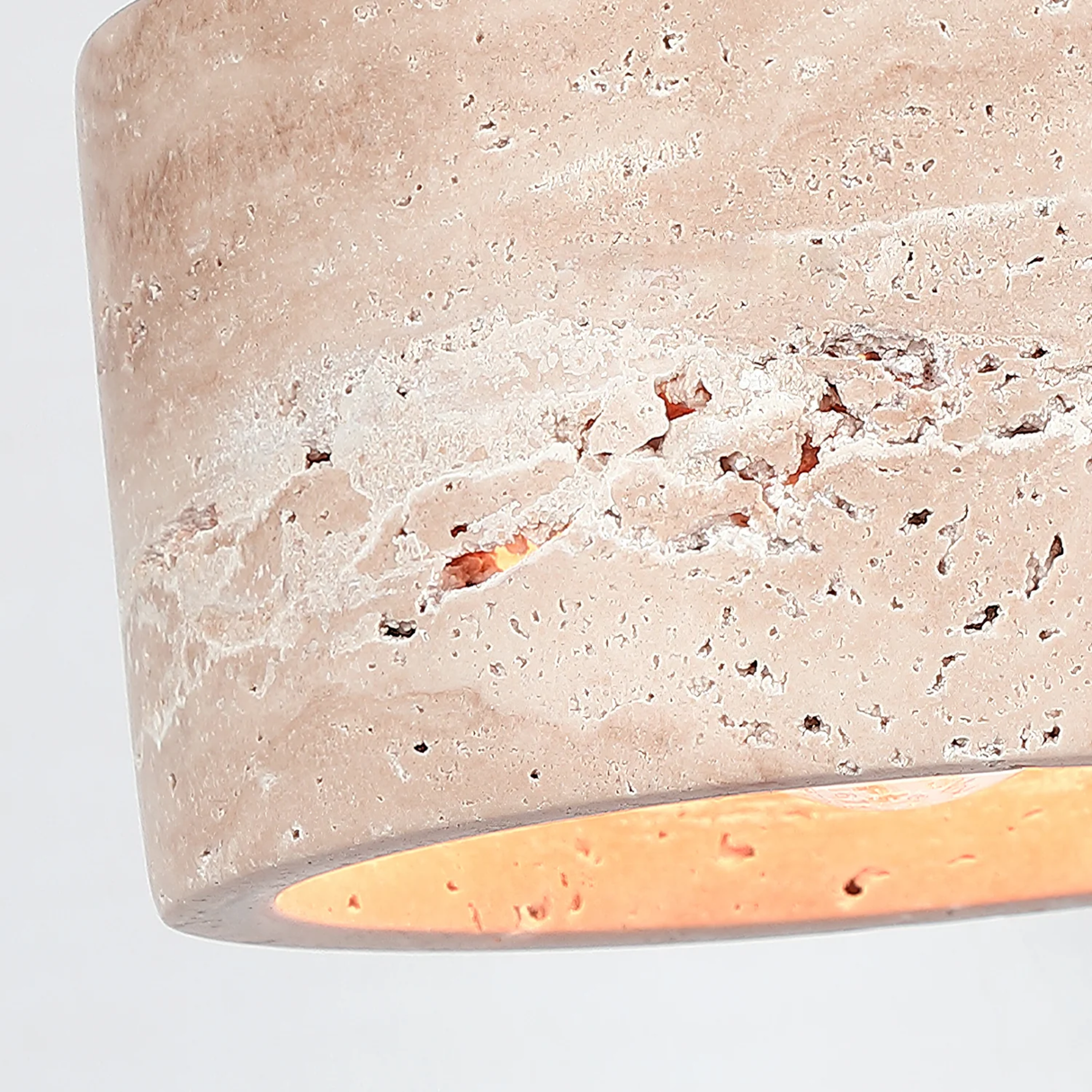 Close-up of a textured concrete surface with a light interior
