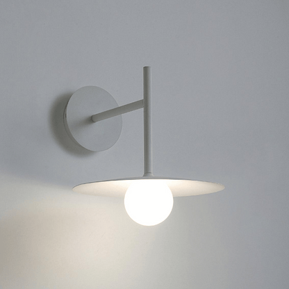 Modern wall-mounted light fixture on a plain background
