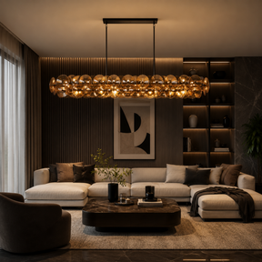 Modern living room with a chandelier, sofa, and coffee table.