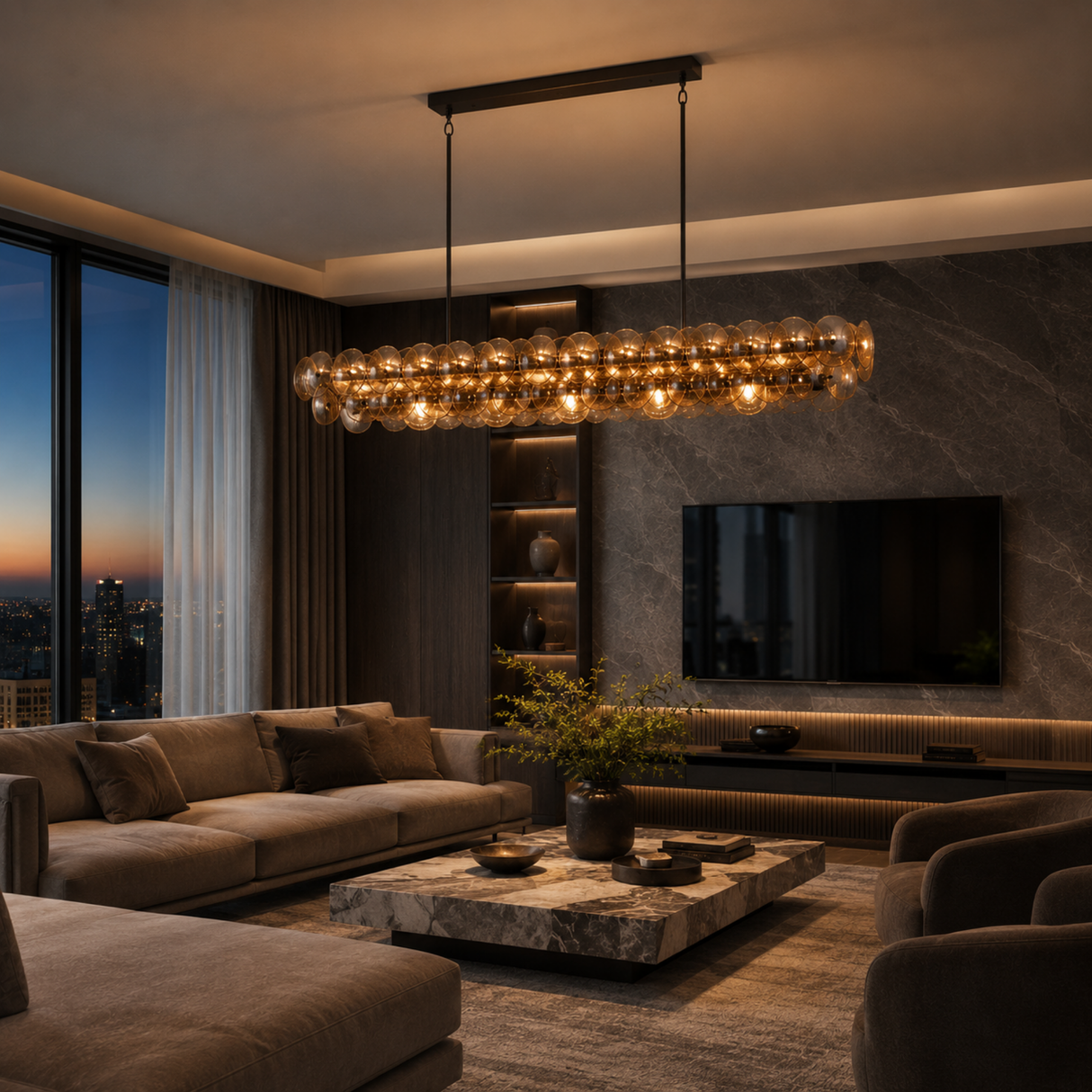 Modern living room with a chandelier, sofa, and TV in a dimly lit setting.
