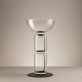 Modern glass table lamp with a beige background