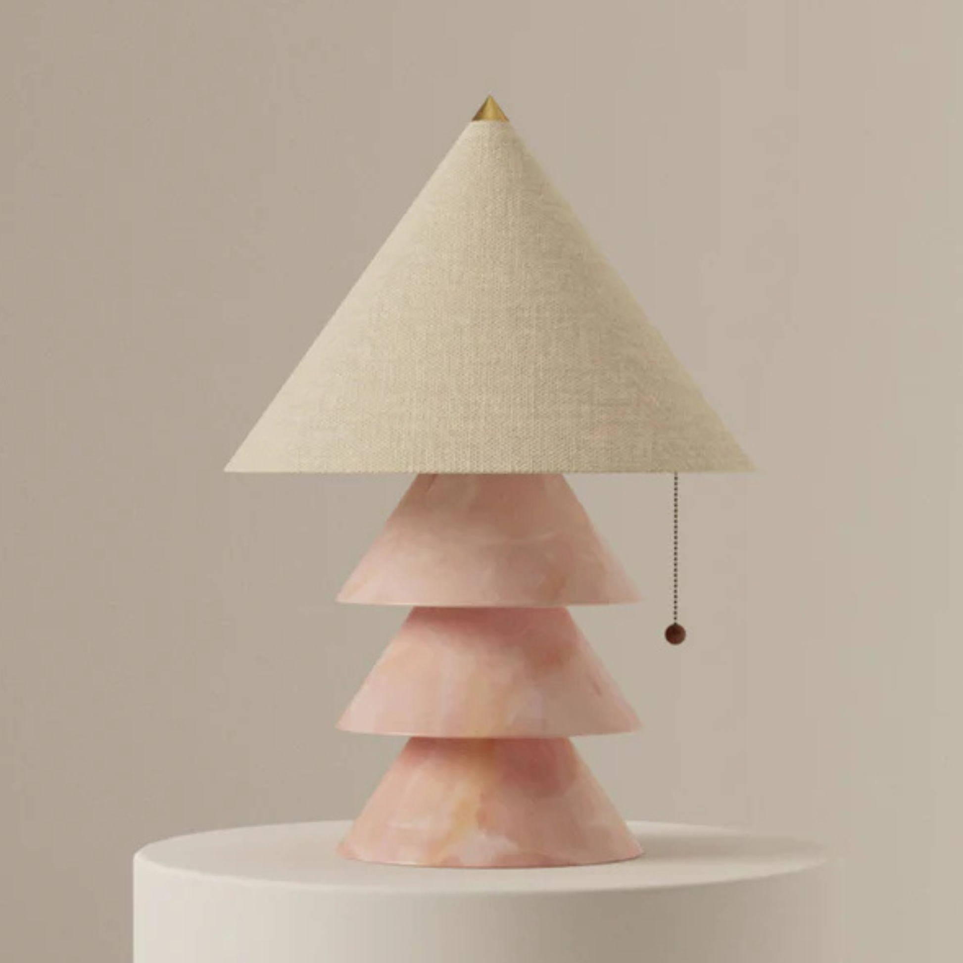 Pink onyx version of the tiered cone lamp with beige shade on a round pedestal.