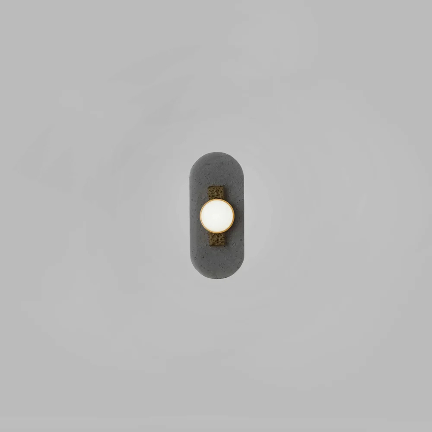 vertical sconce with three dome lights attached to brass bar on textured black plate