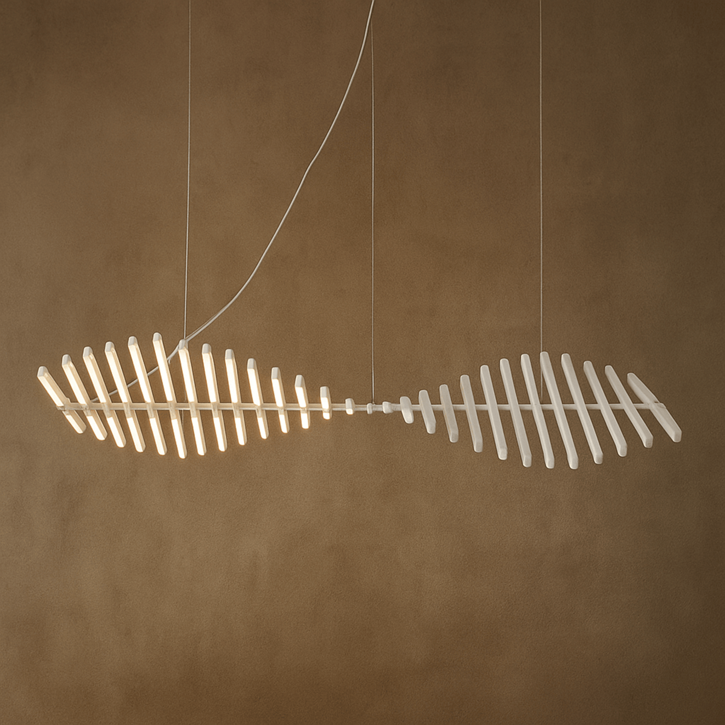 Fishtail-shaped light fixture on a brown background
