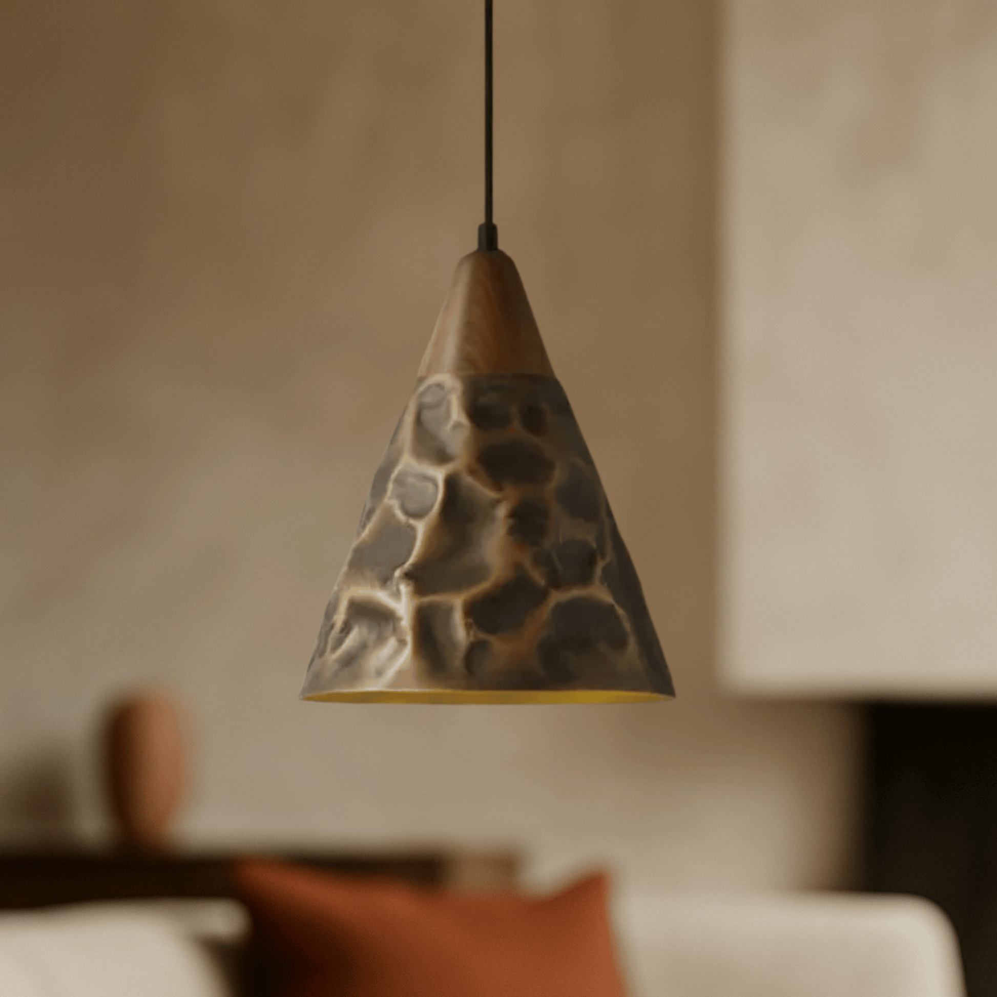 Elegant pendant light  that combines vintage walnut and copper finishes in living room.