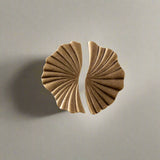 Pair of solid brass knobs on a white background