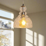 Amber glass pendant light on a white background