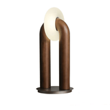 Modern table lamp with curved wooden design on a white background