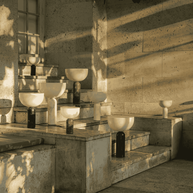Art installation with abstract sculptures in a sunlit room.