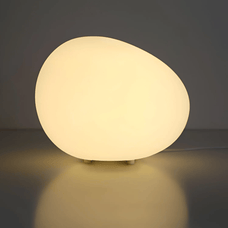 Round, glowing light fixture on a dark background