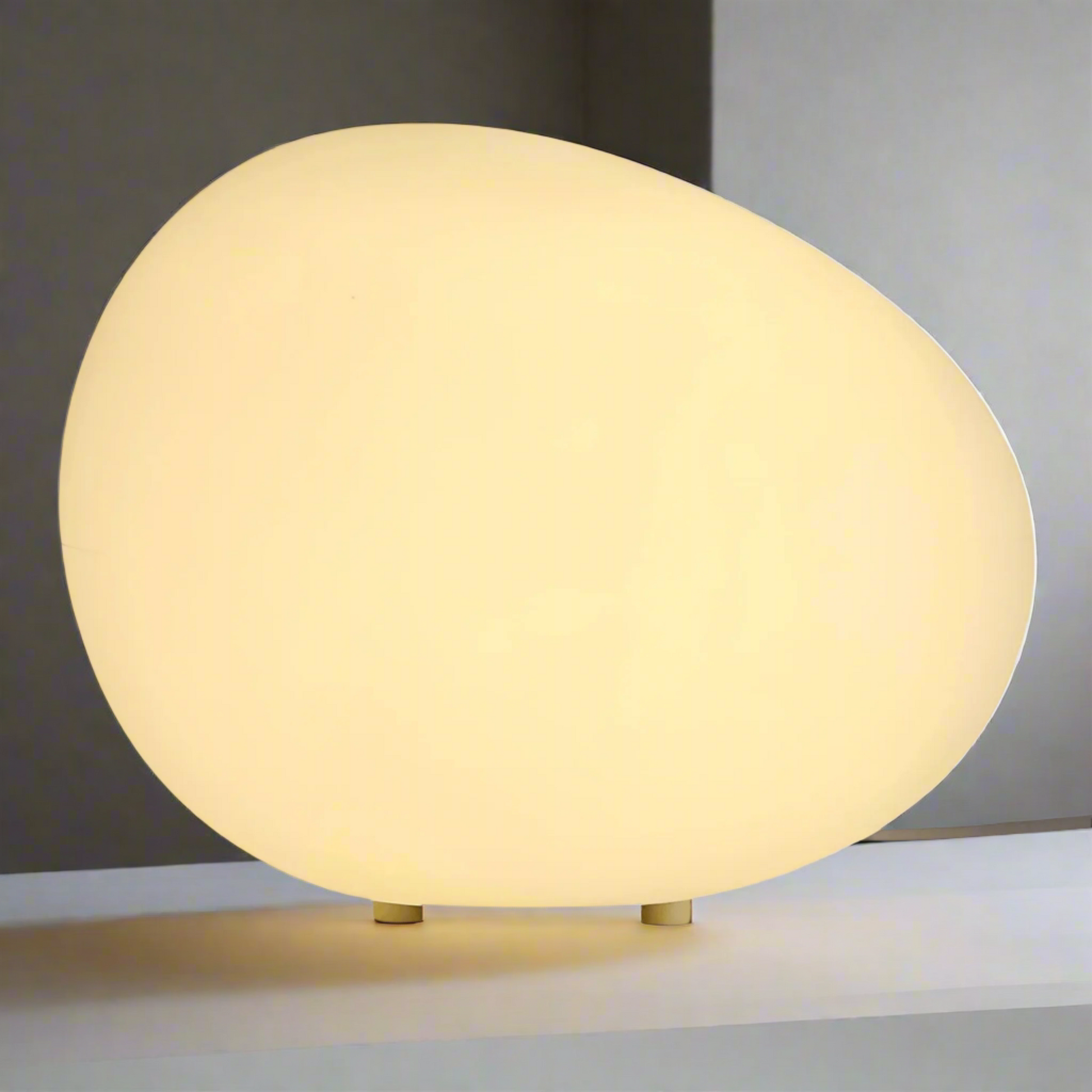 Round beige table lamp on a white background