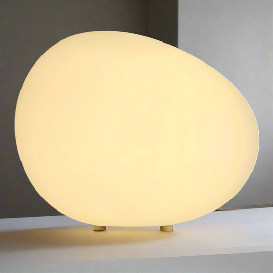 Round beige table lamp on a white background