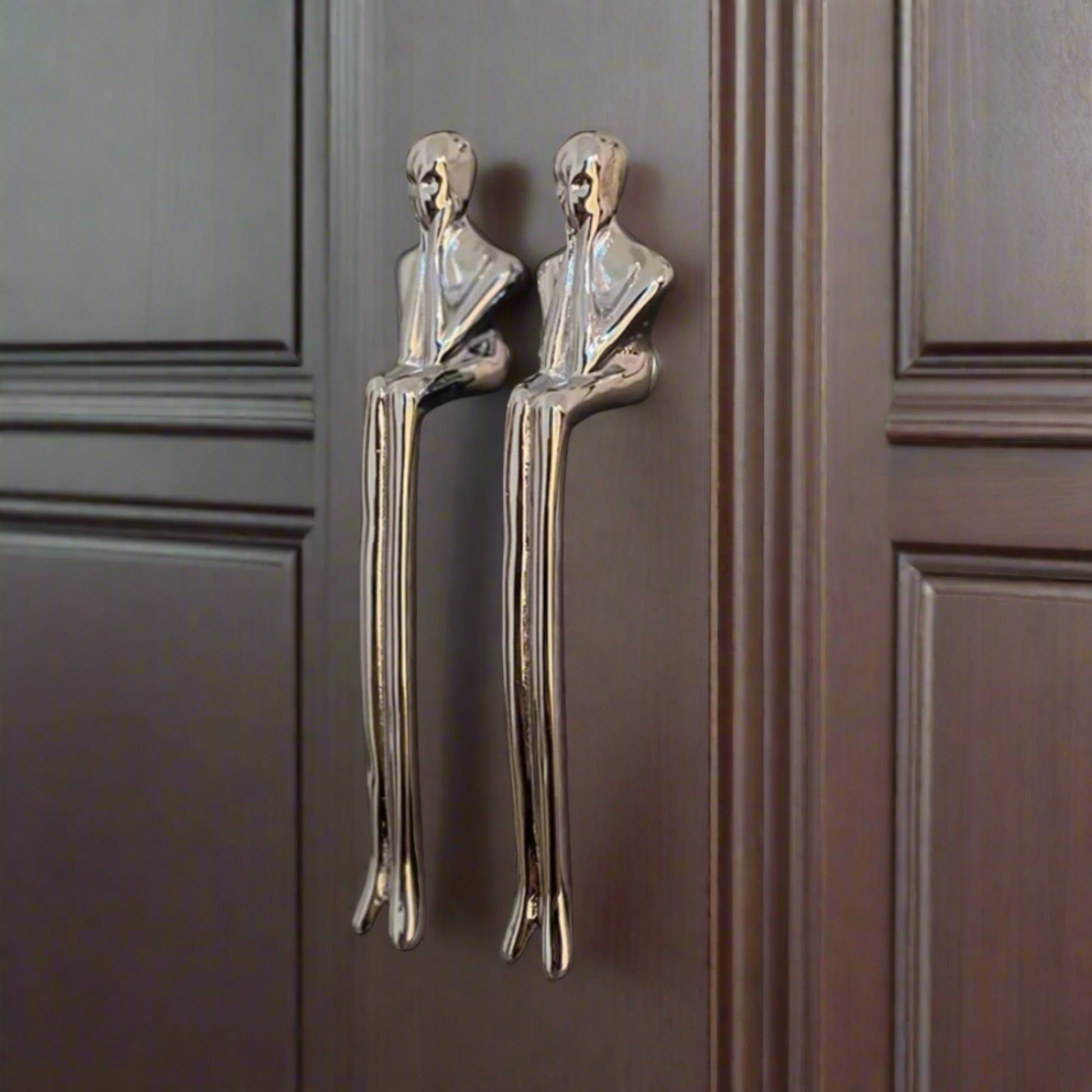 Silver earrings on a dark surface with 'Diana Hardware' branding.