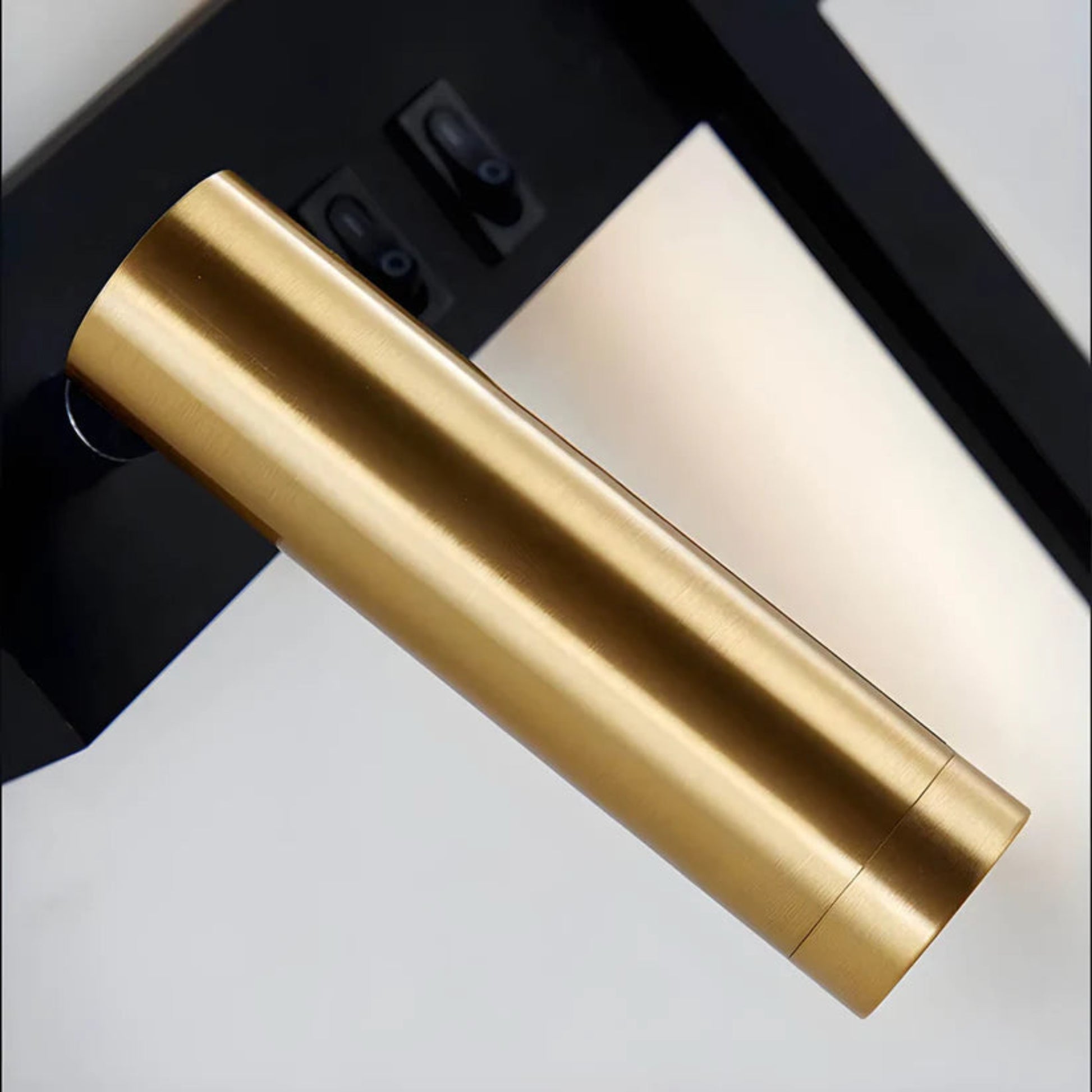 Gold cylindrical object on a black background