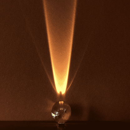 Vintage-style light bulb with a warm glow on a dark background